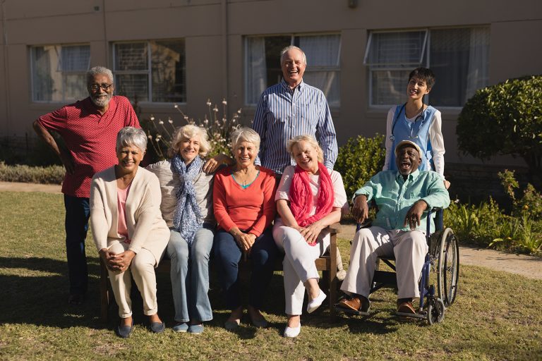 Portrait of active and diverse group of senior people posing in the park